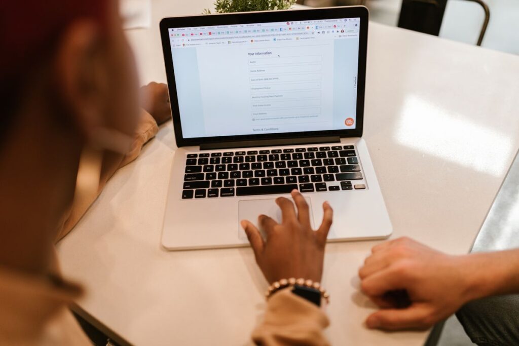 Form optimization in action: refining contact form fields on a laptop