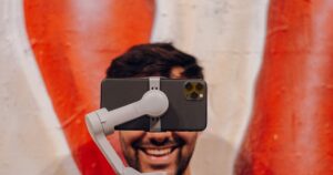 Smartphone on gimbal with smiling person background