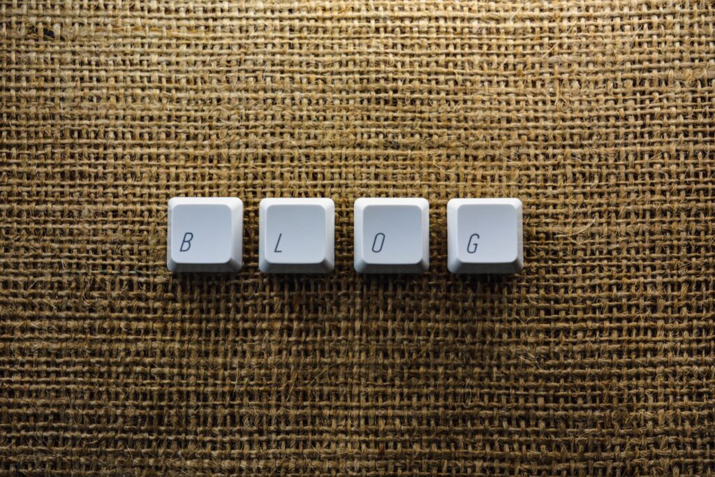 Blog spelled with keyboard keys on burlap