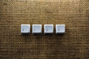 Blog spelled with keyboard keys on burlap