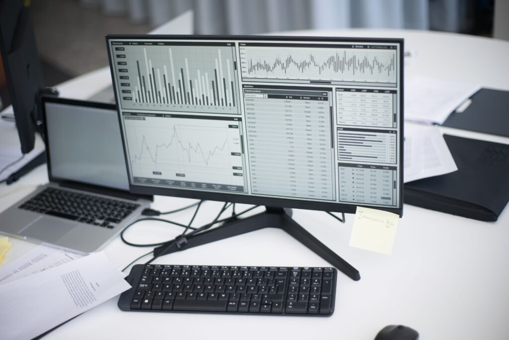Computer displaying financial data and graphs