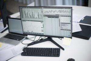 Computer displaying financial data and graphs