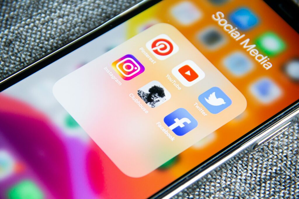Social media app icons on a smartphone for a brand audit