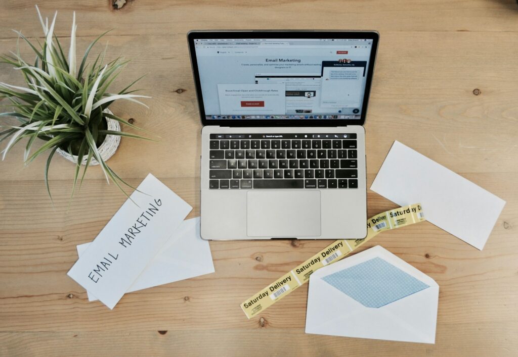 Laptop and pricing documents for budgeting AEO services