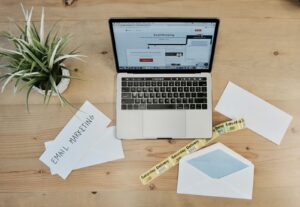 Laptop and pricing documents for budgeting AEO services